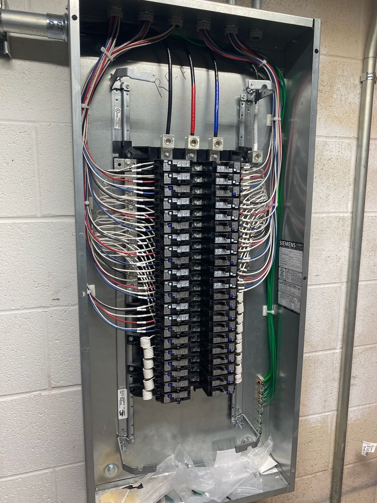 A large electrical box with a lot of wires coming out of it.