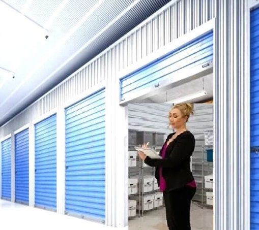 woman taking inventory of business supplies in storage unit