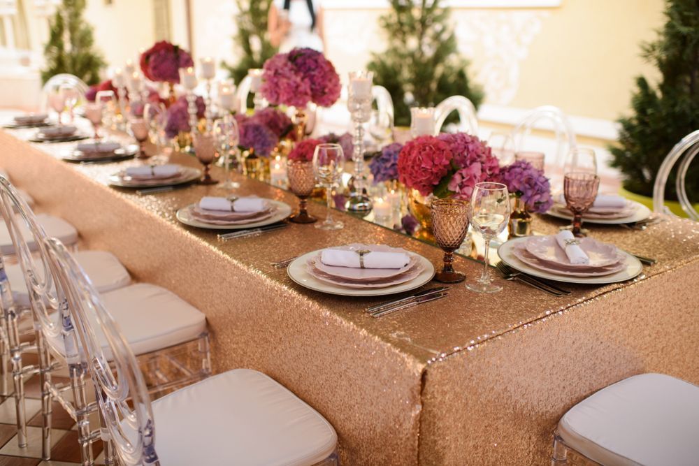 A Long Table With Plates, Glasses, and Flowers Placed on It — Event Hire in Wodonga, NSW
