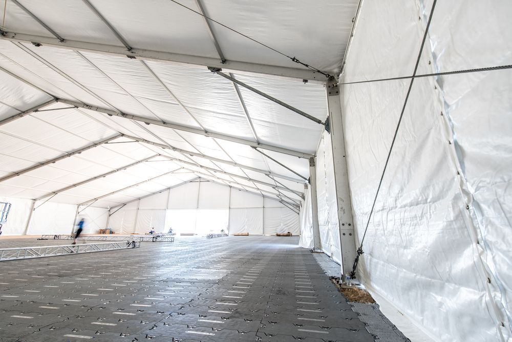 Photograph of a Spacious White Marquee with a Polished Concrete Floor — Event Hire in Wodonga, NSW