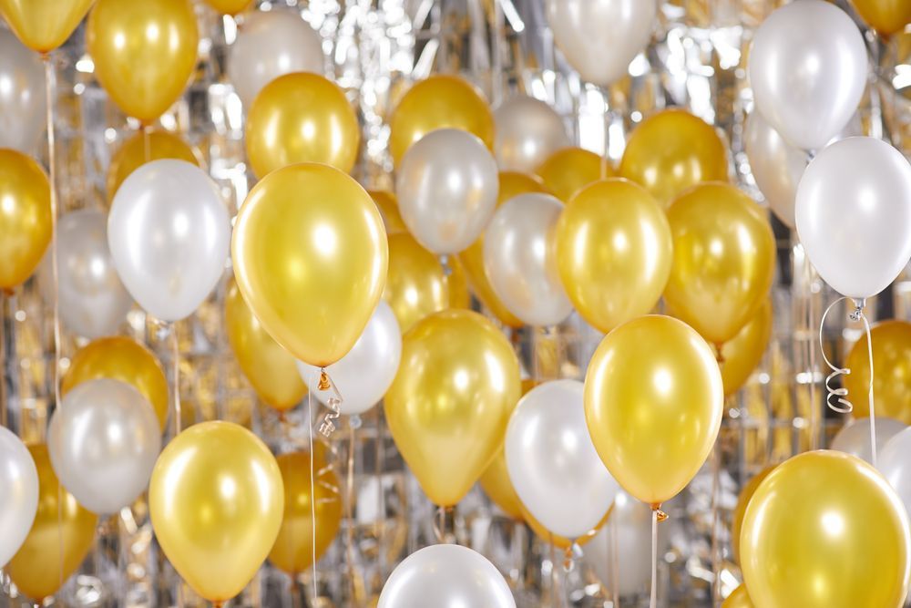 A Bunch of Gold and White Balloons Hanging From The Ceiling — Event Hire in Albury, NSW
