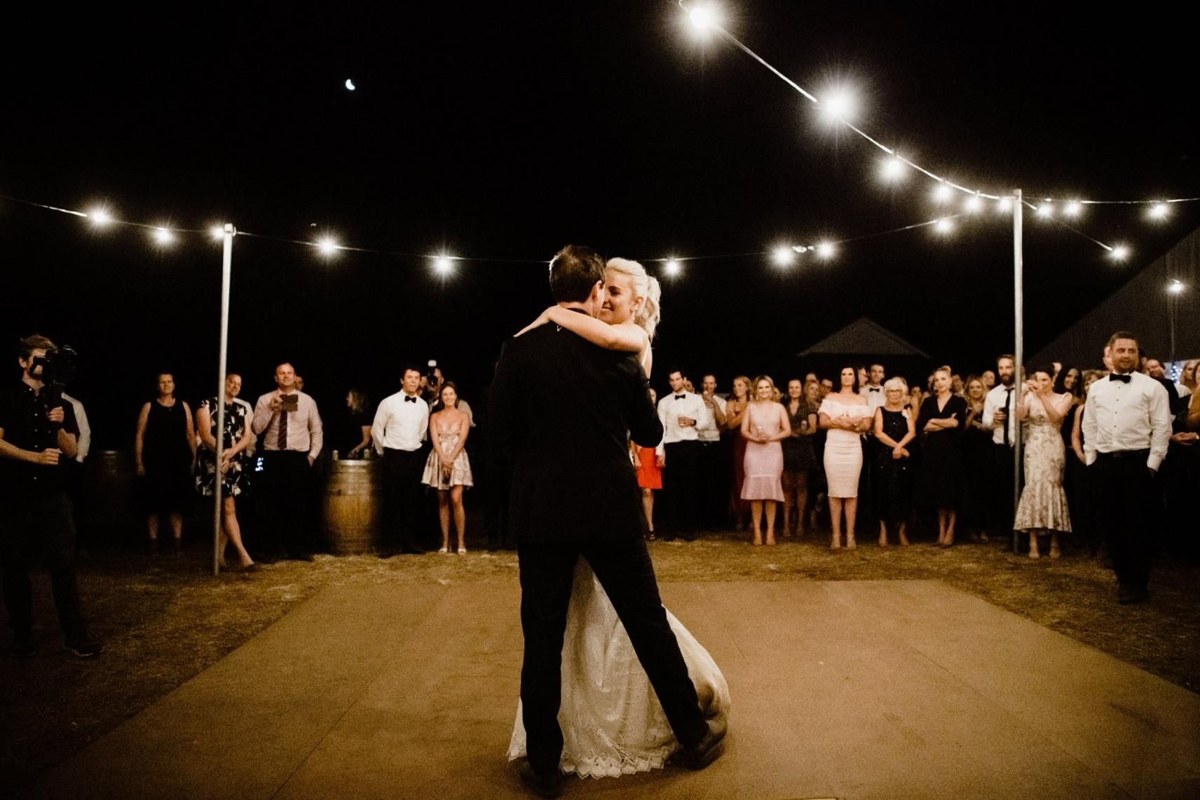 A Bride and Groom are Dancing on a Dance Floor at Their Wedding Reception — Event Hire in Wodonga, NSW