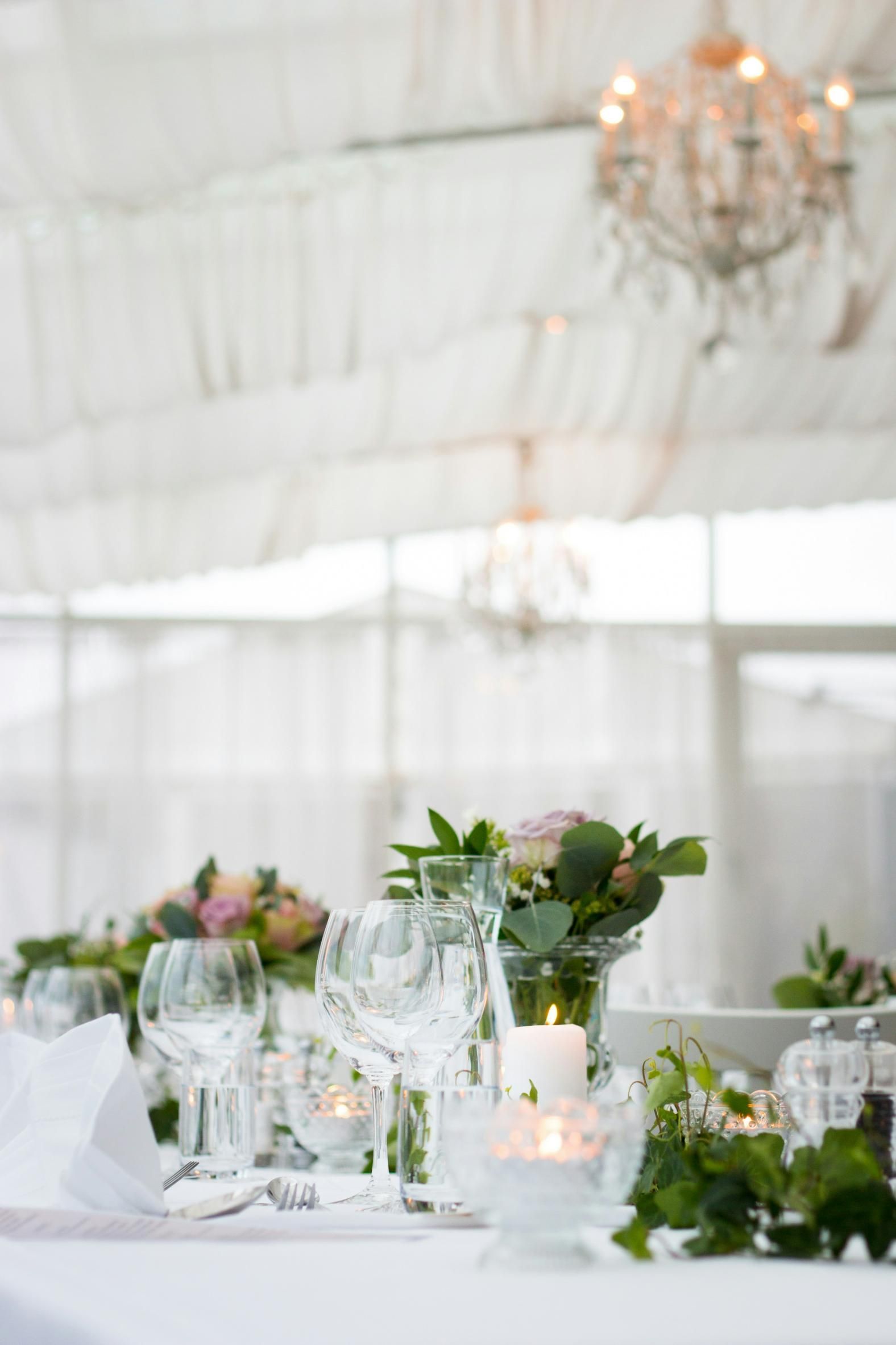 A Table Set For a Wedding Reception With Flowers and Candles on It — Event Hire in Wodonga, NSW