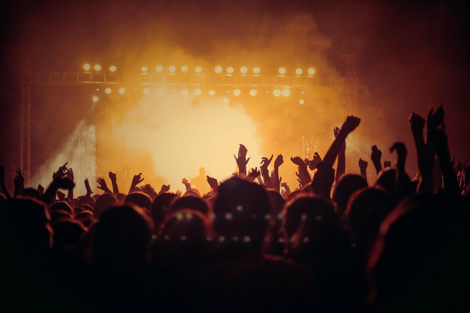 A Crowd of People are Dancing in Front of a Stage at a Concert — Event Hire in Wodonga, NSW