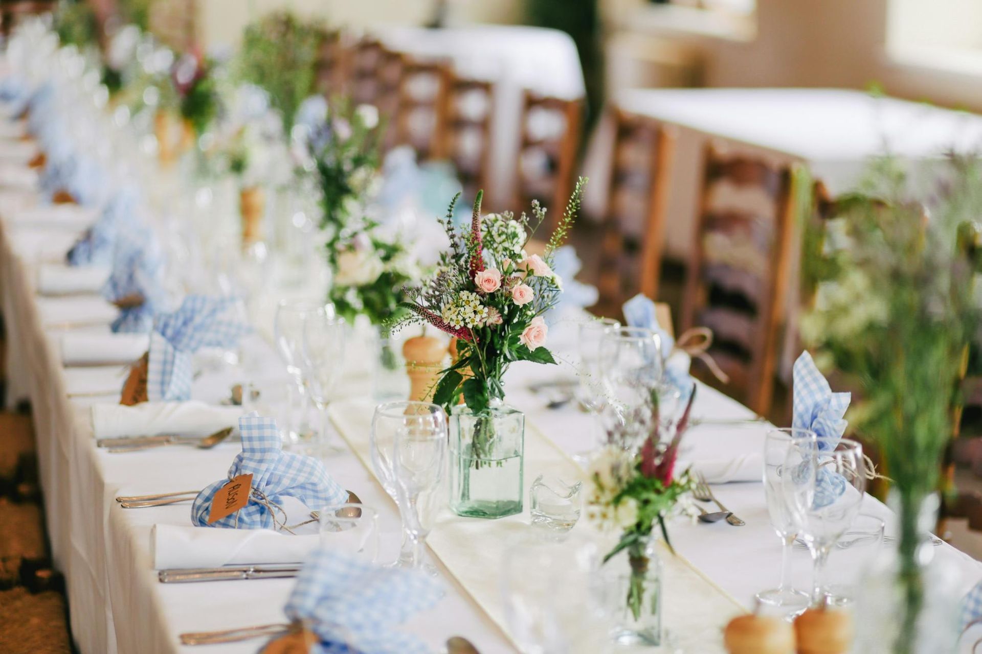Elegant Wedding Reception Setting: Long Table Adorned with Flowers — Event Hire in Wodonga, NSW