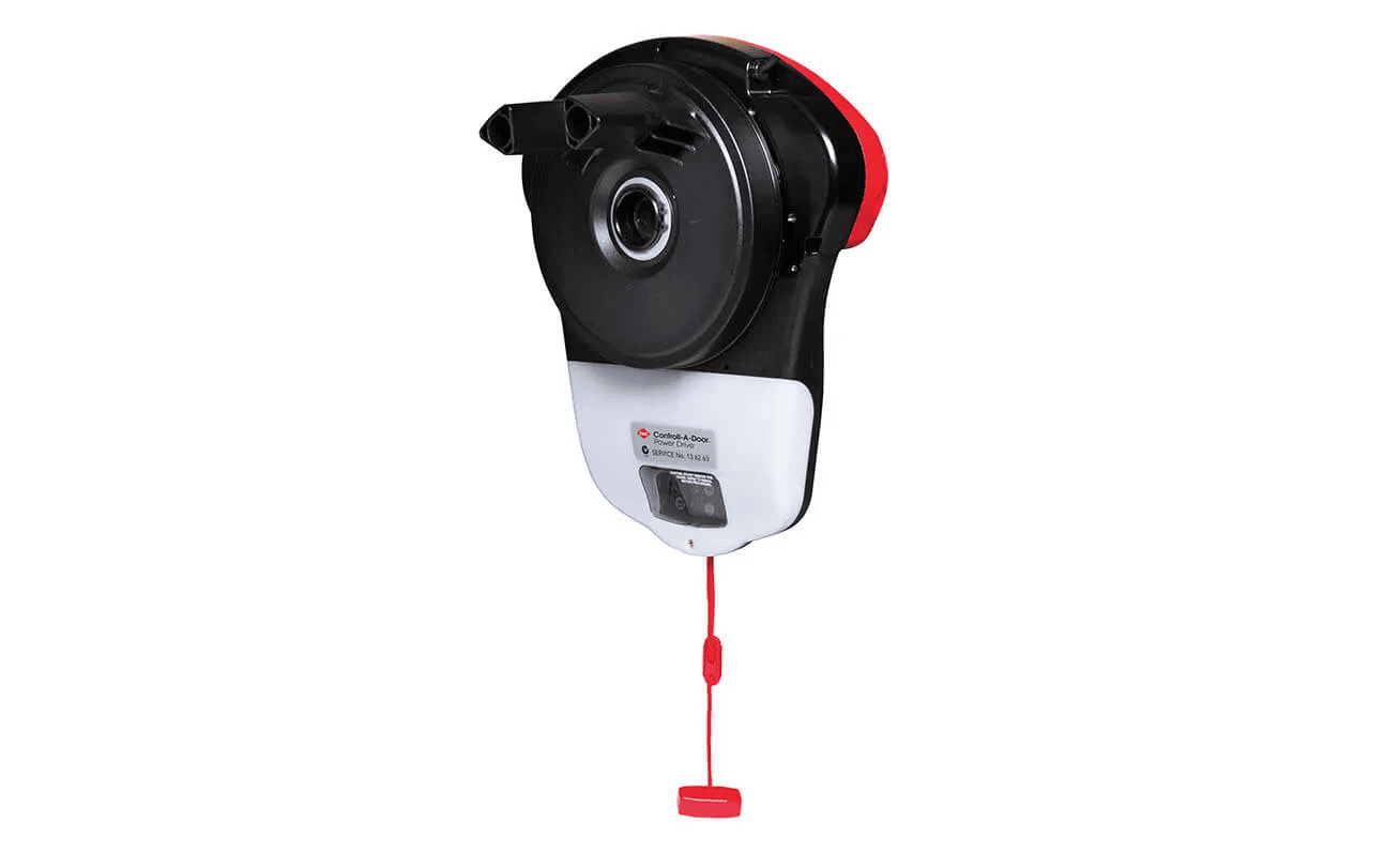 A black and white garage door opener with a red cord attached to it.