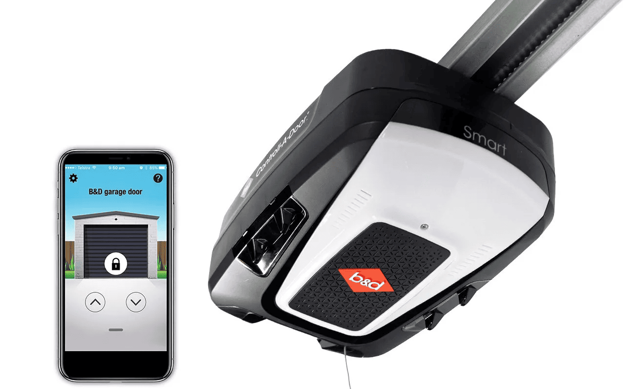 A garage door opener with a remote control next to a cell phone.