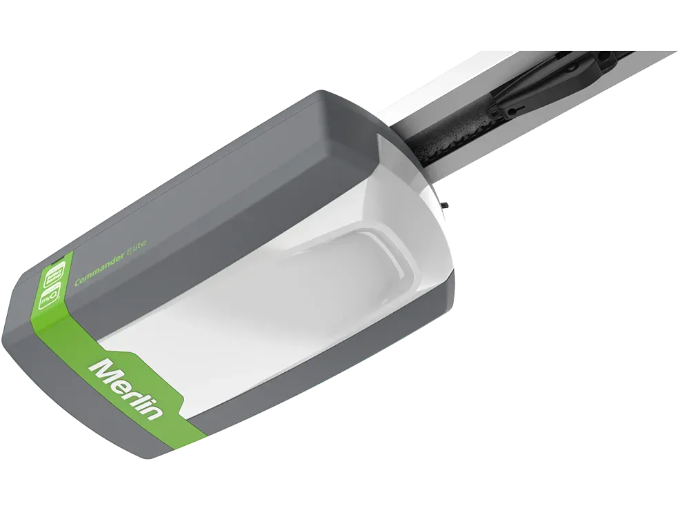 Gray and white Merlin garage door opener with green label.