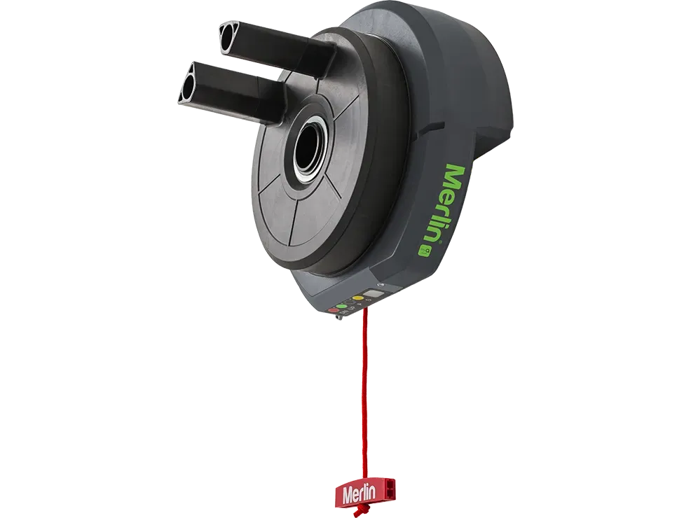 Gray and white Merlin garage door opener with green label.