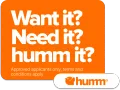 An orange sign that says want it need it humm it