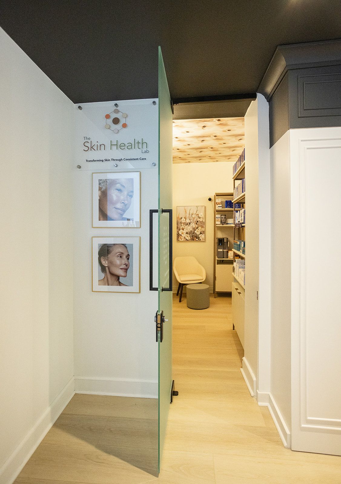 Interior design of Skin Health Lab retail area on Locke Street Hamilton featuring custom shelving and a calming neutral palette.