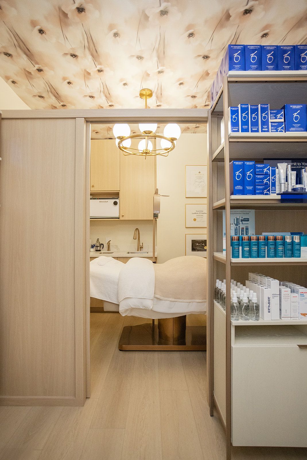 Boutique medspa floor plan optimization showing a custom sliding wall open to connect the retail space with consultation areas.