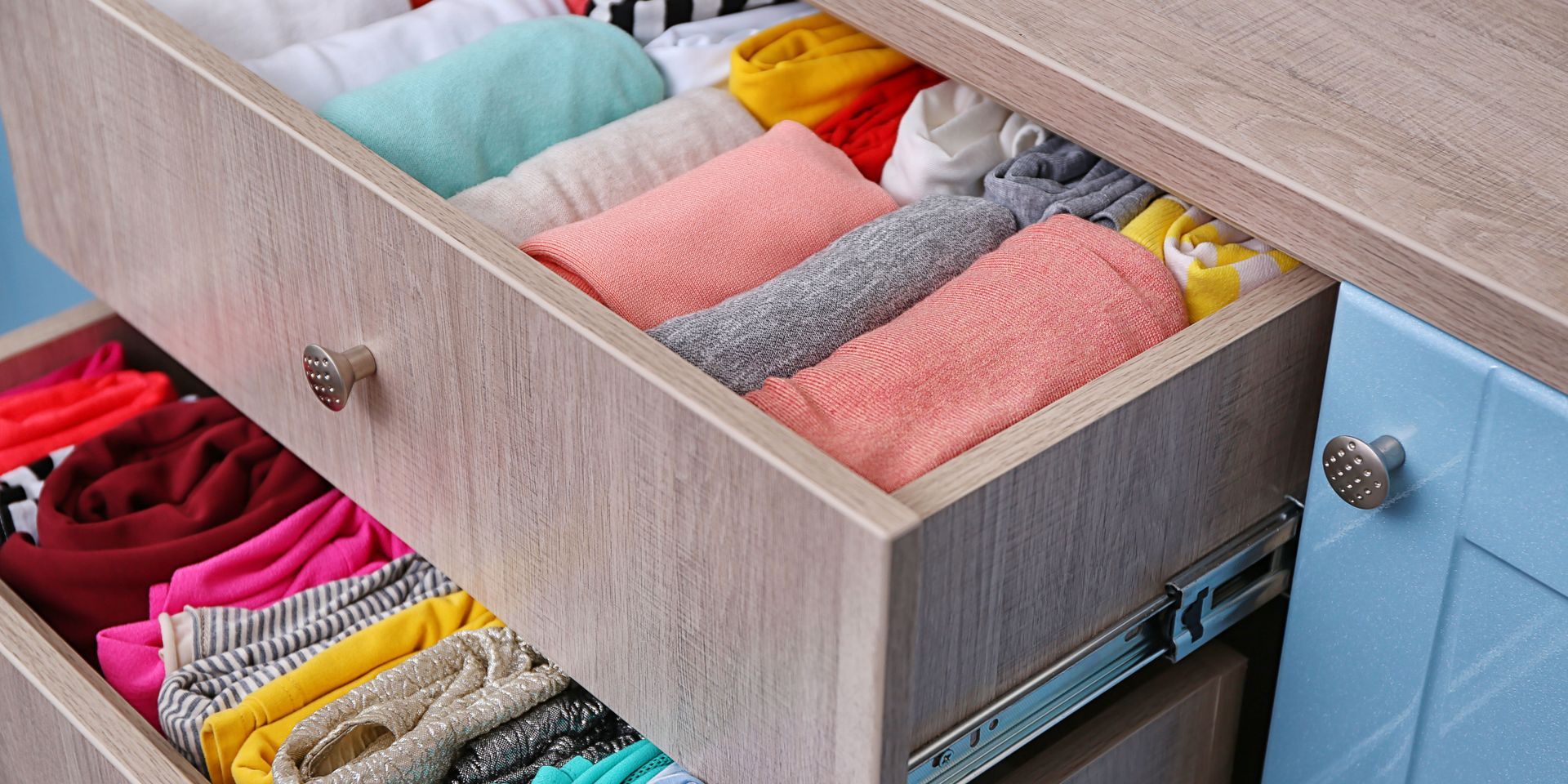 A drawer filled with folded clothes and socks.