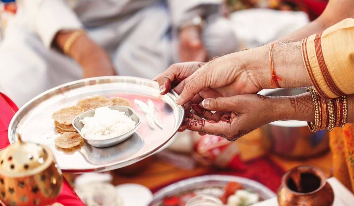 A mehendi ceremony with guests enjoying chaat and snacks
