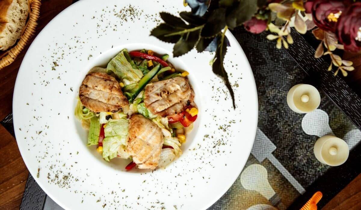 A plated gourmet paella dish served at a high-end wedding
