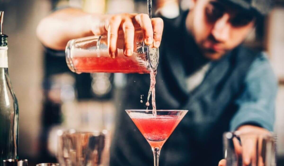 bartender mixing cocktail at event