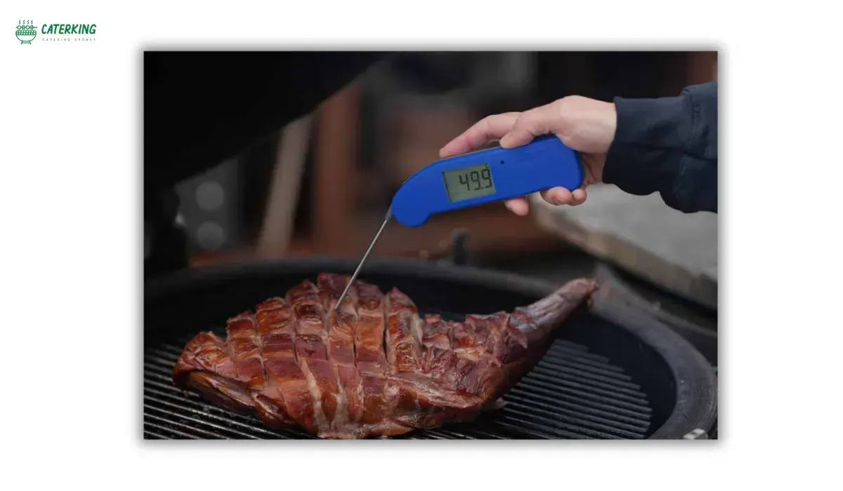 checking lamb internal temperature using probe thermometer
