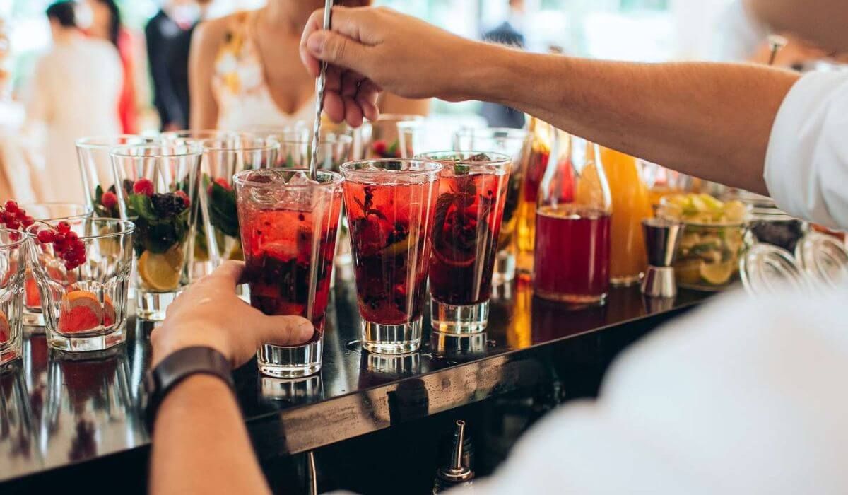 wedding guests at the cocktail bar