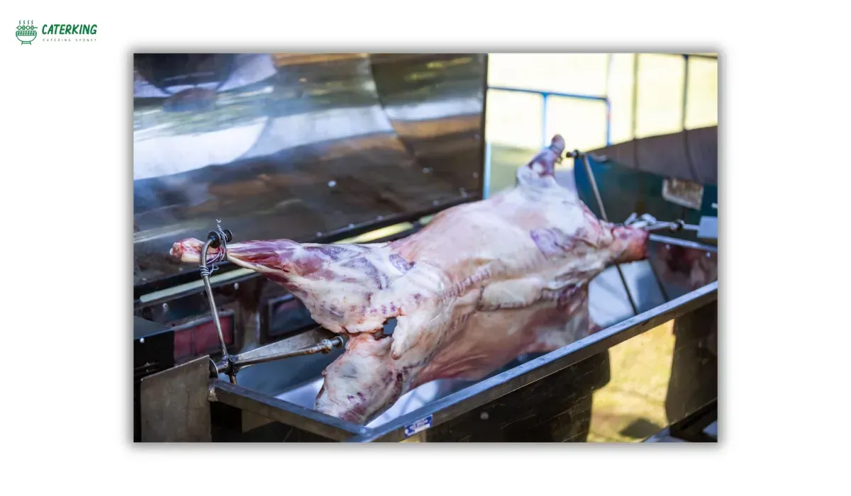 whole lamb mounted and secured on spit rod with bindings for even rotation