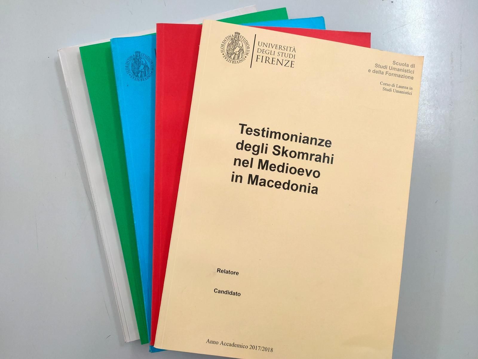 Stack of colorful file folders with text 