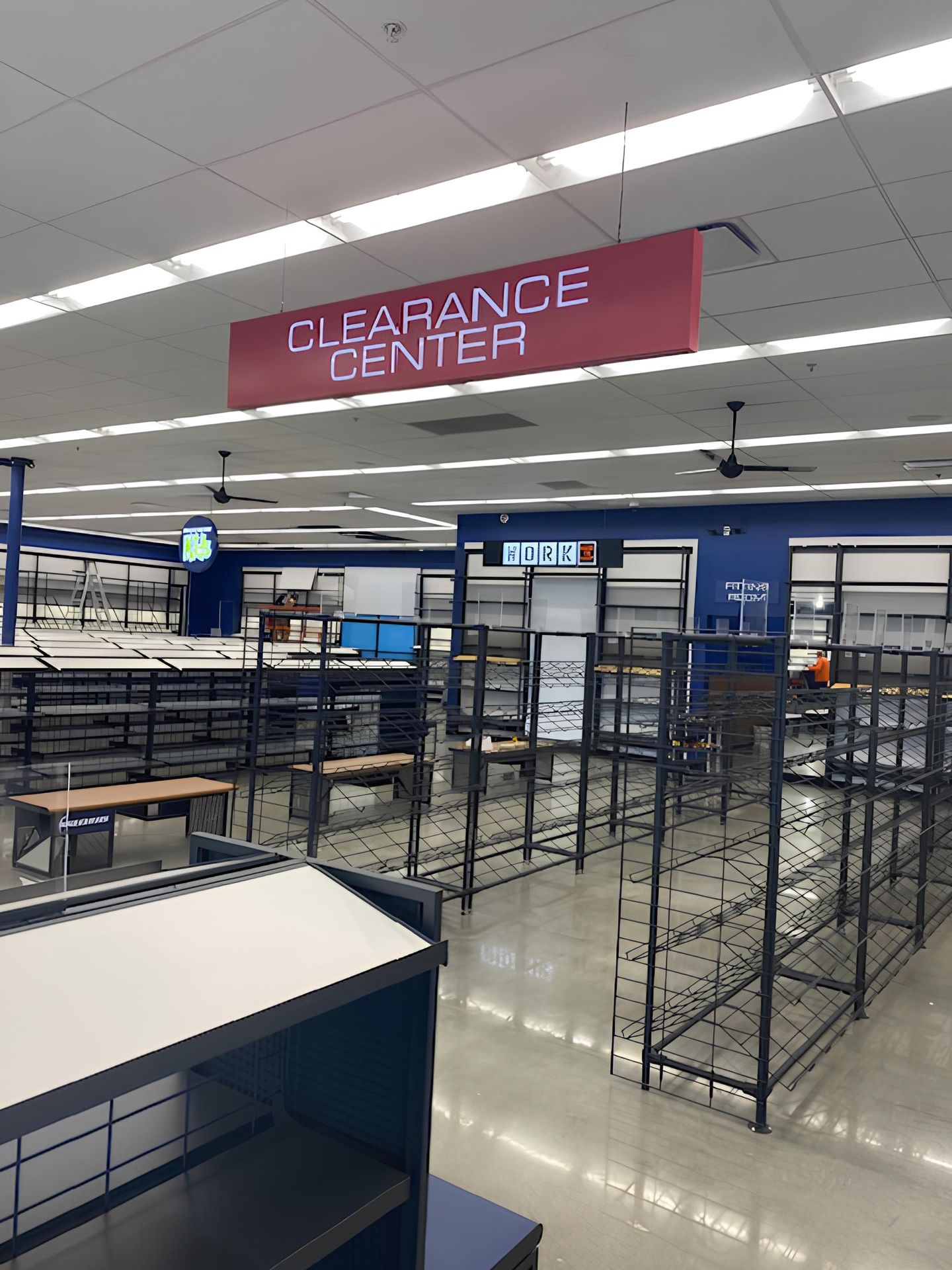 An empty store with a sign that says clearance center