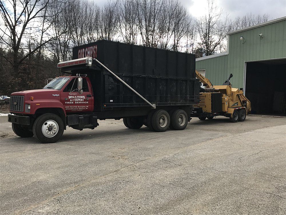 A red dump truck — Dowagiac, MI — Williams A-1 Expert Tree Service