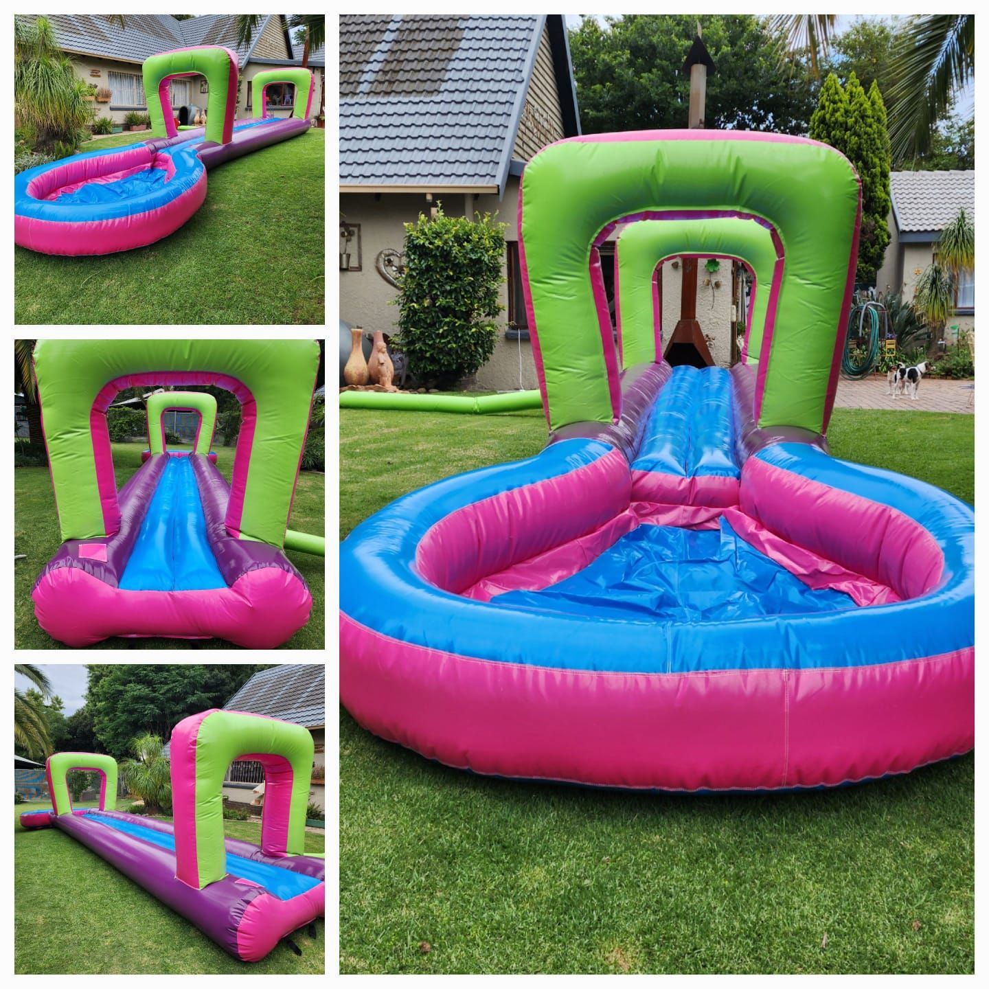 A pink and green inflatable water slide is sitting on the grass in front of a house.