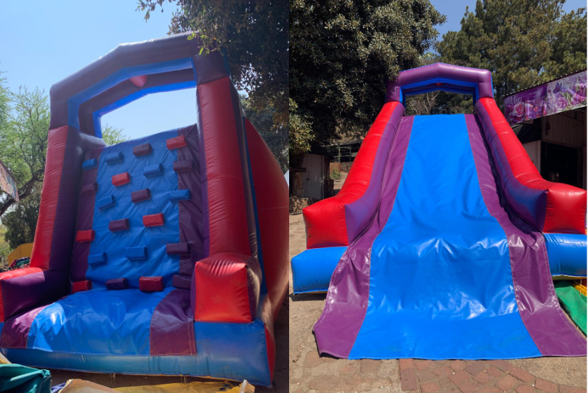 A red and yellow bouncy house with a climbing wall