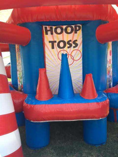 A red and blue inflatable hoop toss game