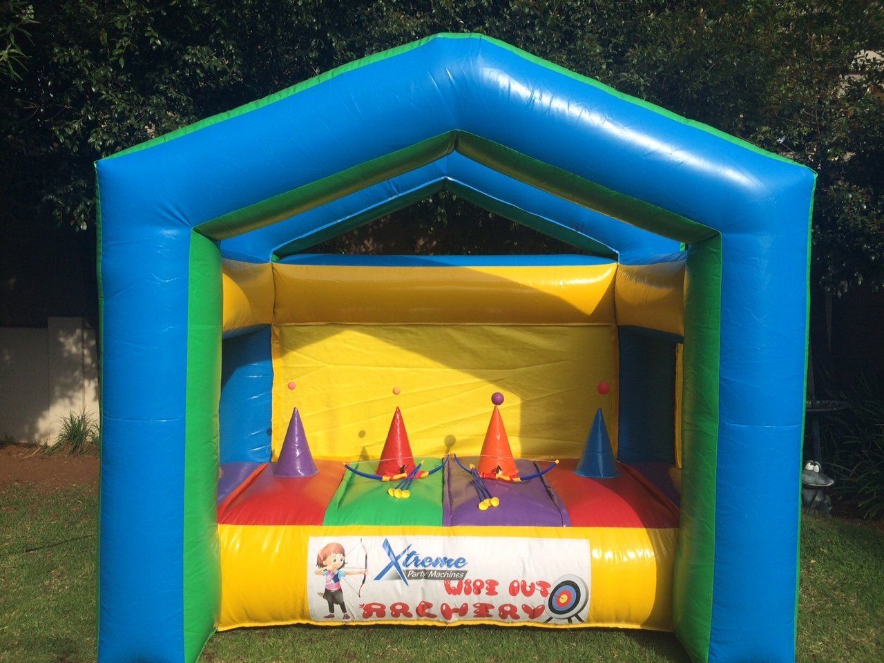 A colorful bouncy house with a sign that says xtreme
