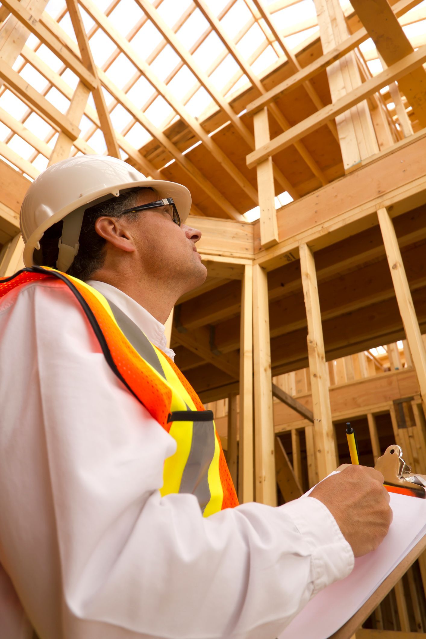 A building inspector surveys a new home build | Timber Products | Brisbane