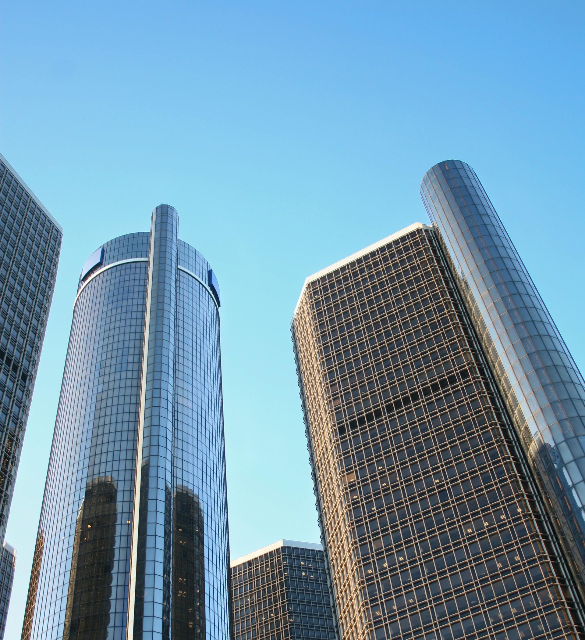 A snowy mountain with a blue sky in the background