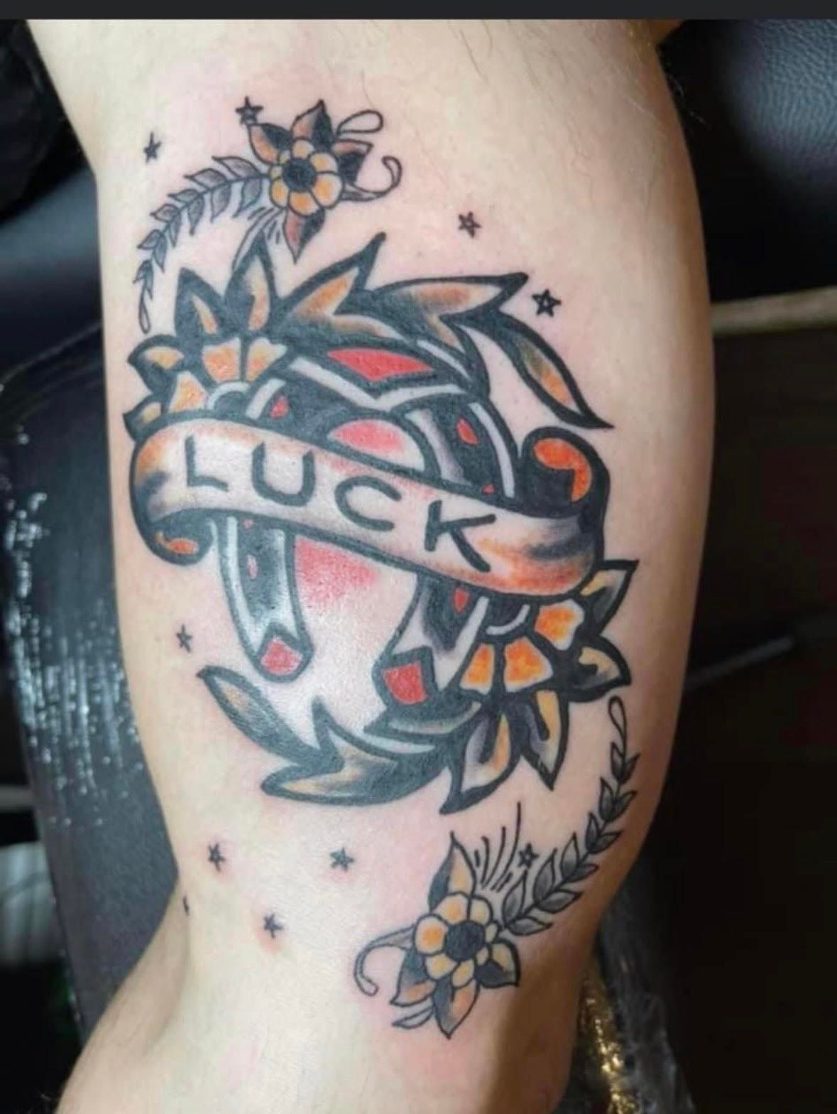 Tattoo of a horseshoe with 