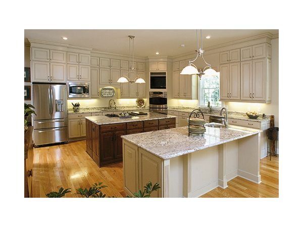 Dark green laundry room with cabinets, washer/dryer, and a hanging rod.