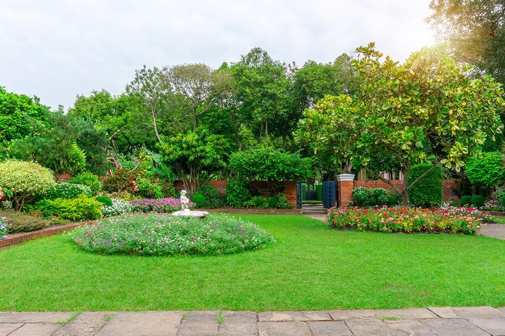 There is a fountain in the middle of the garden.