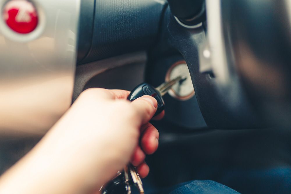 A person is holding a car key in their hand — Locksmith in Surfers Paradise, QLD