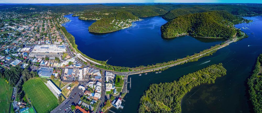 Aerial view of a lake with a small island in the middle — Locksmith in Brisbane, QLD