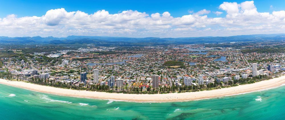 Aerial view of a city with mountains in the background — Locksmith in Burleigh Heads, QLD