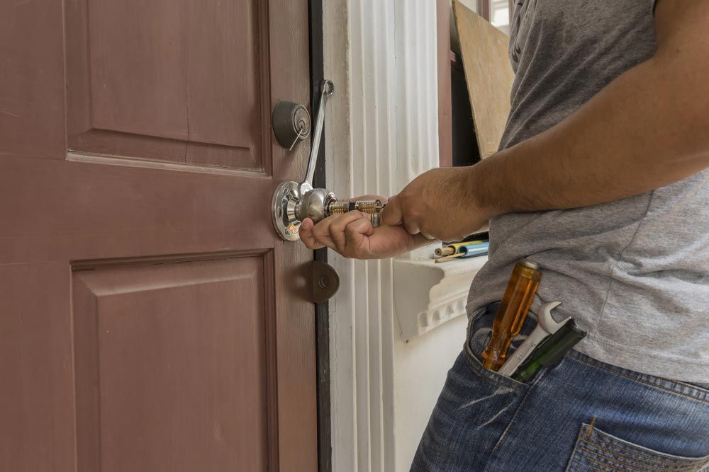 A 24-Hour Locksmith On The Gold Coast Working On A Door Lock