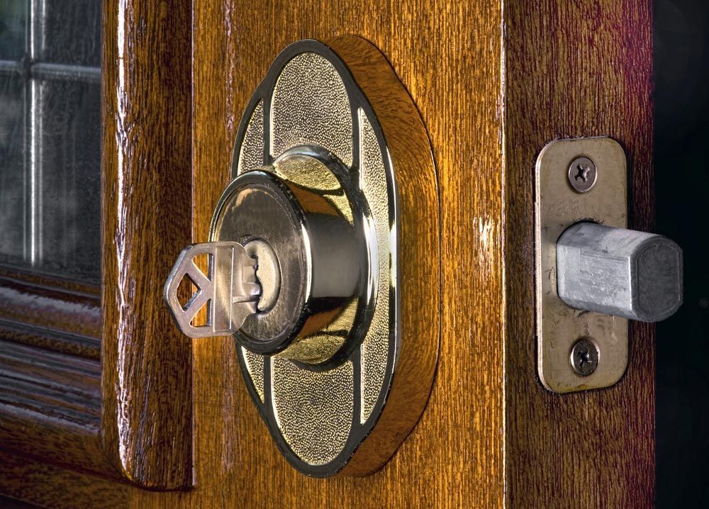 A Close Up Of A Door Lock With A Key In It — Border Locksmiths & Electronics In Tweed Heads, NSW