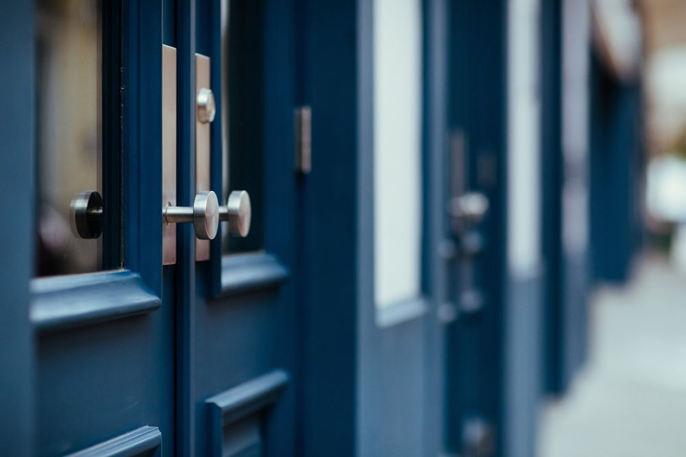 A close up of a blue door with a silver handle — Locksmith in Byron Bay, NSW