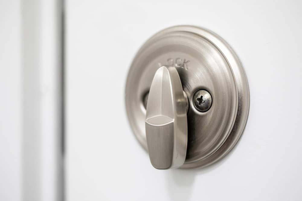 A Close Up Of A Door Lock On A White Door — Border Locksmiths & Electronics In Tweed Heads, NSW