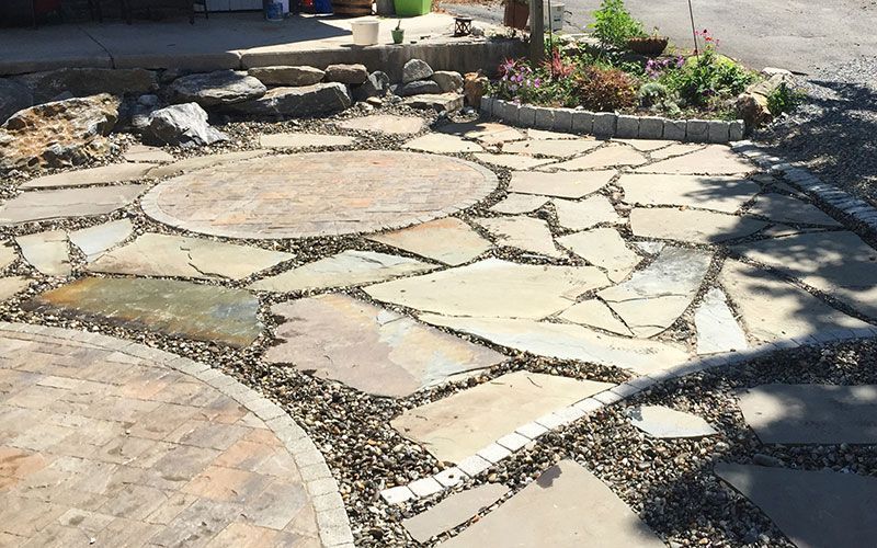 A stone walkway with a circle in the middle of it