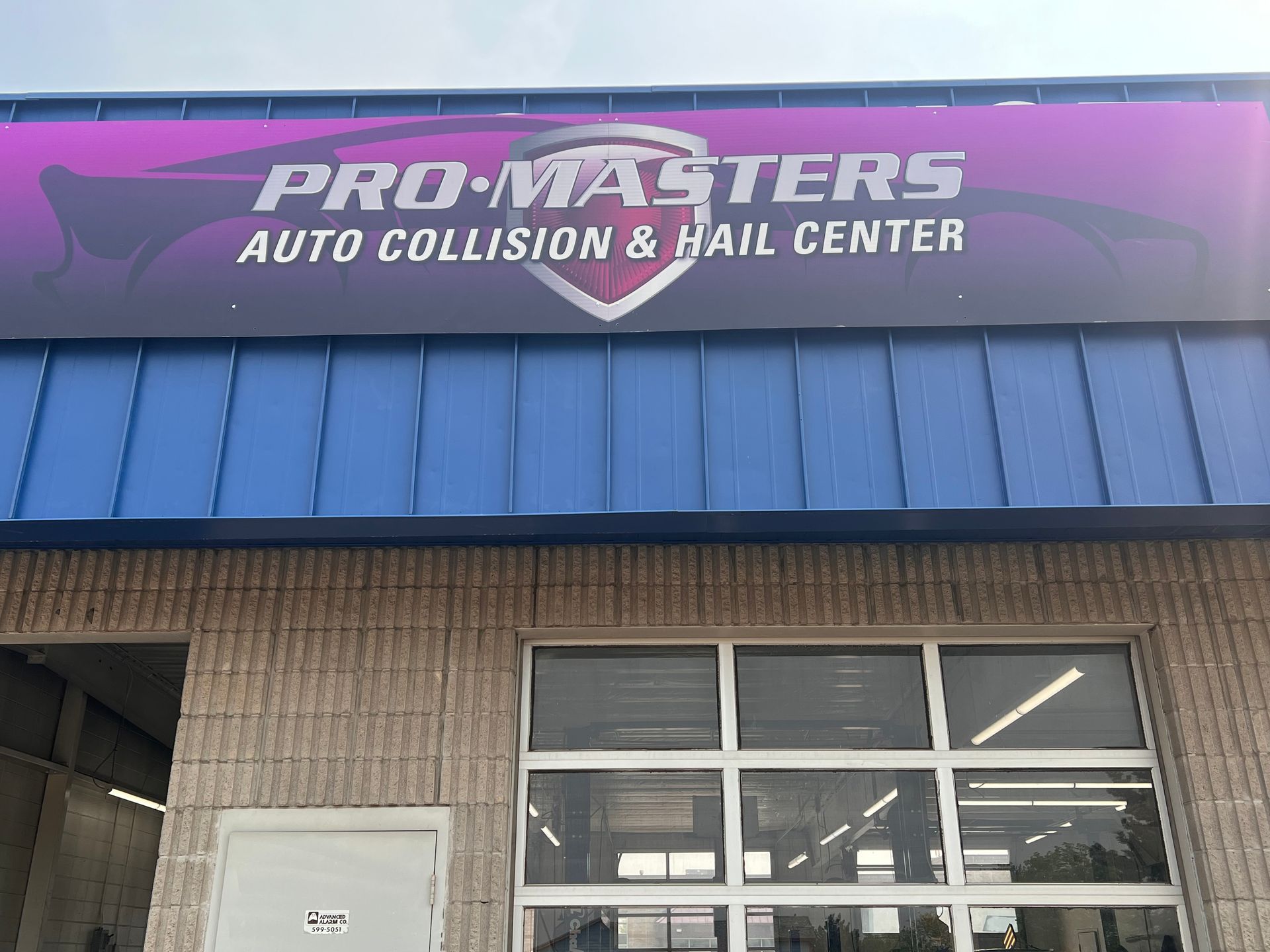 The front of a pro masters auto collision and hail center