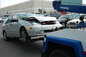 White Car Being Towed