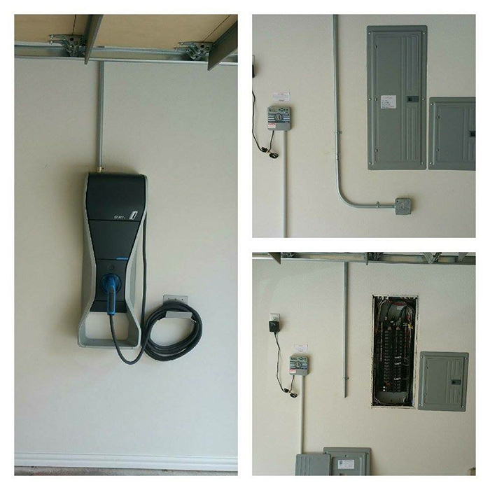 Electric vehicle charger installed on a garage wall, along with electrical panels and conduit.