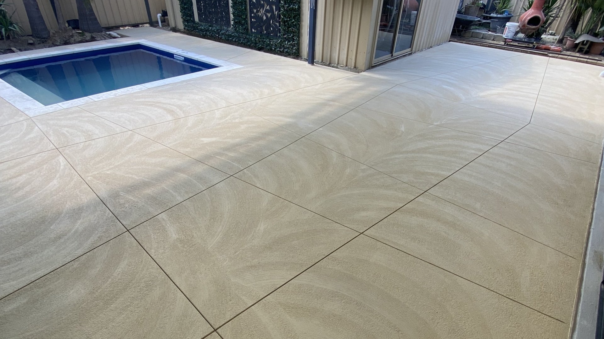 Liquid limestone around pool and under patio