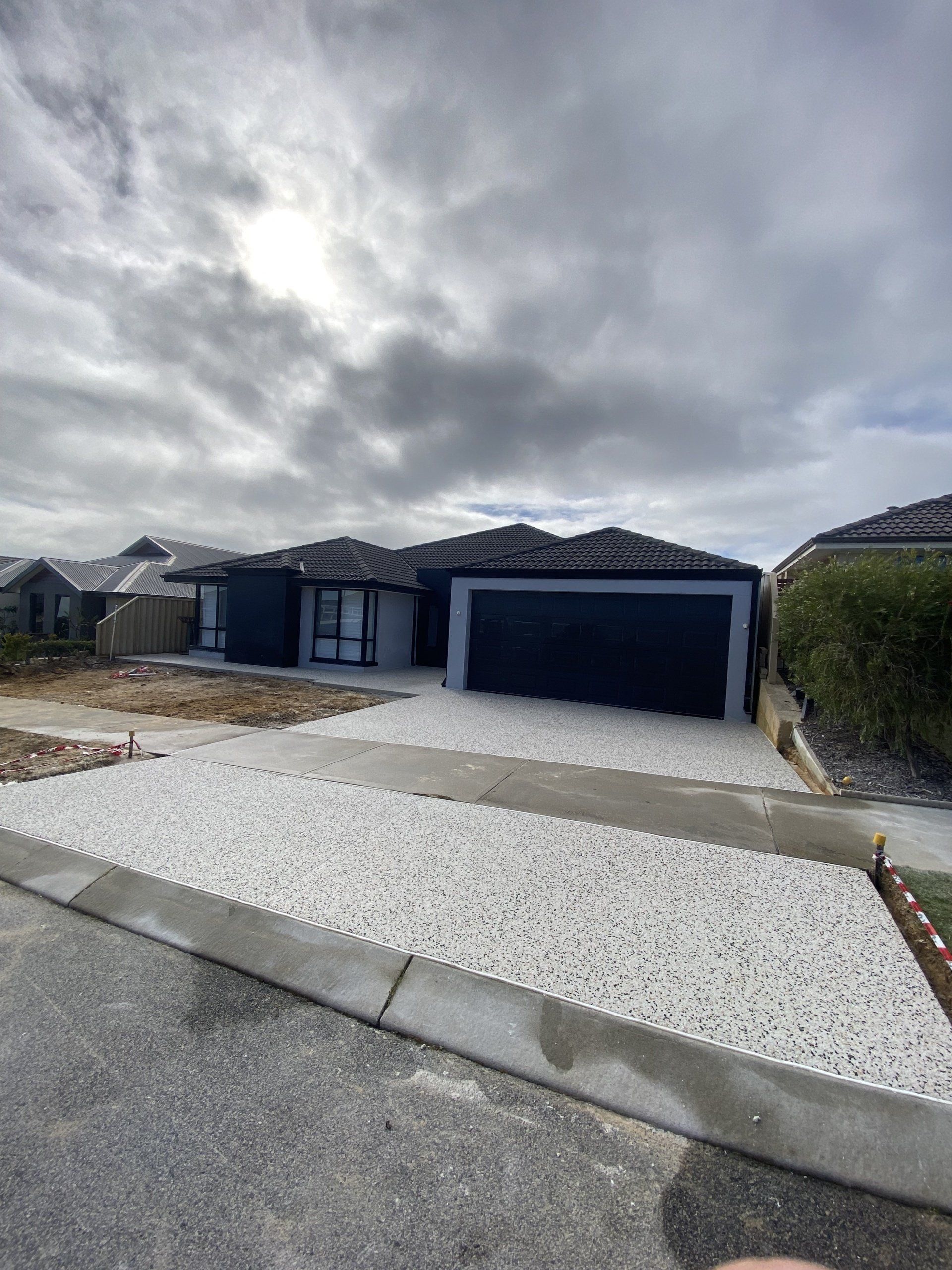 Pros & Cons Of Exposed Aggregate Driveways | PNS Concreting