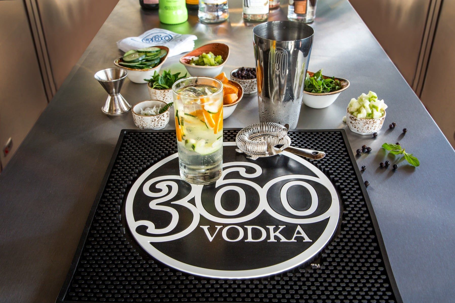 A bar mat with the 360 vodka logo on it