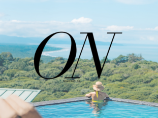 A woman is swimming in a pool with the word on in the background